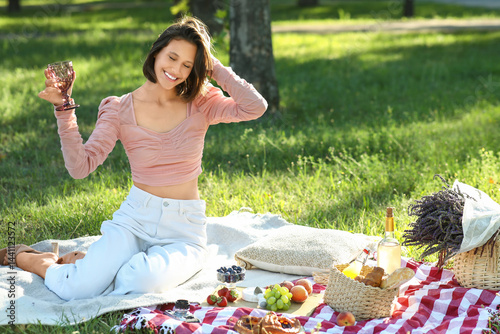 Young woman with glass of w...