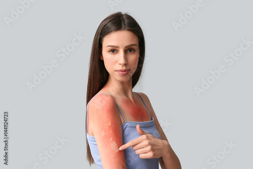 Young woman pointing at red...