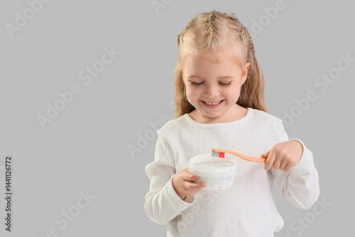 Cute little girl with tooth...
