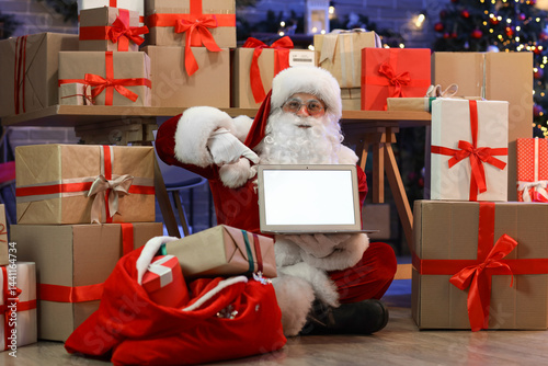 Santa Claus with many gift ...