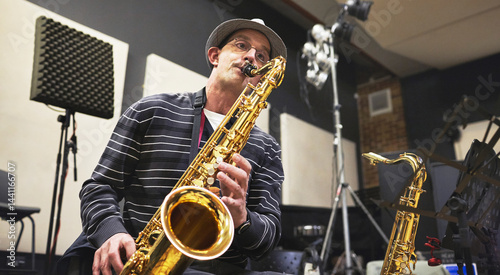 Photography Man, saxophone and play jazz in recording studio for talent song or orchestra entertainment, artist practice in band