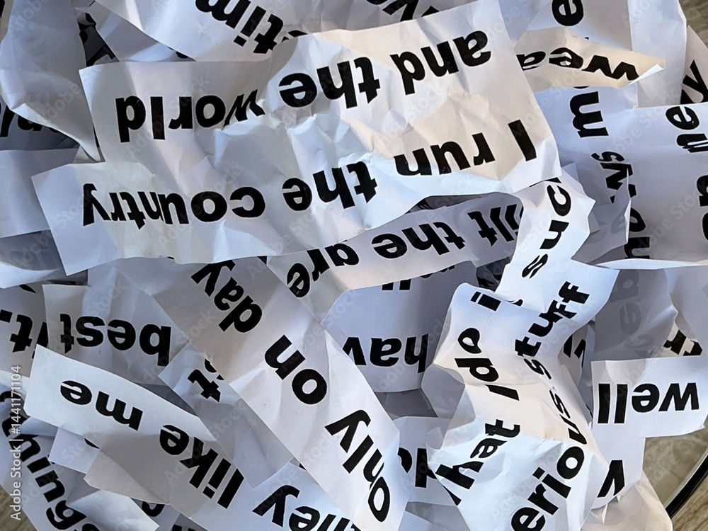 Word salad jumble of crumpled strips of paper with words and phrases Word salad jumble of crumpled strips of paper with words and phrases