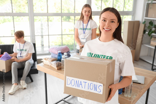 Young female volunteer with...