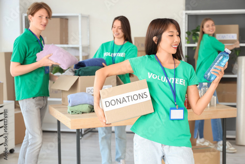 Young female volunteer with...
