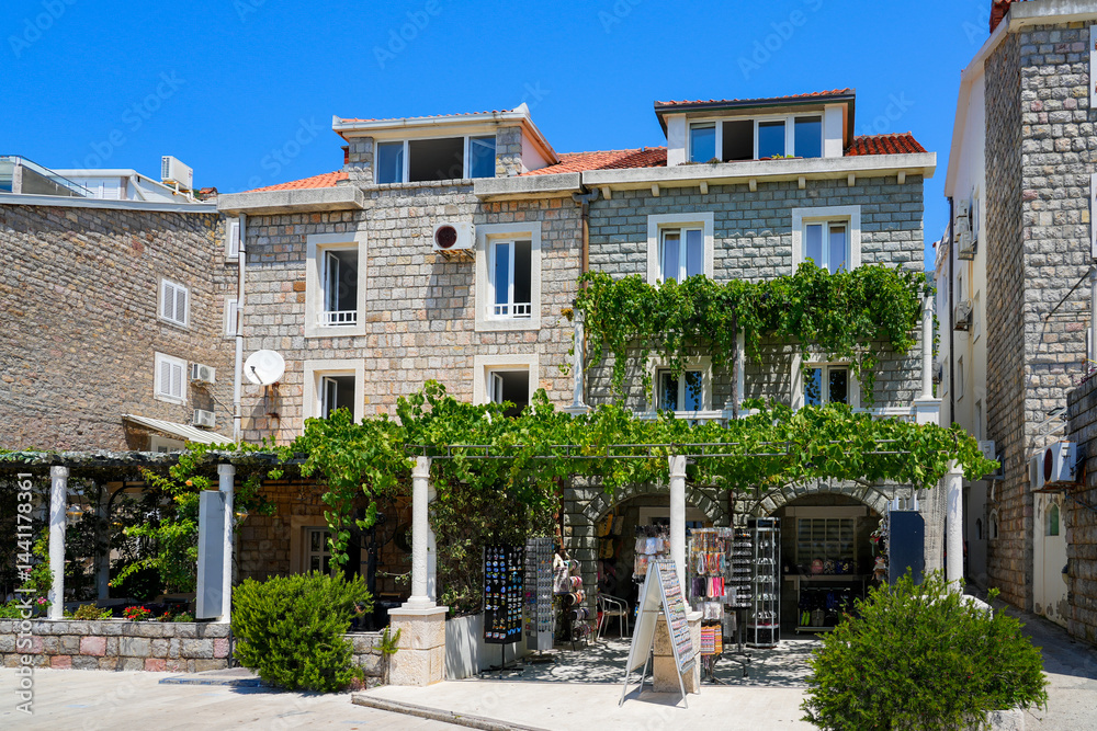 Old stone houses in Petrovac na Moru, a resort town located on the coast of the Adriatic Sea in Montenegro