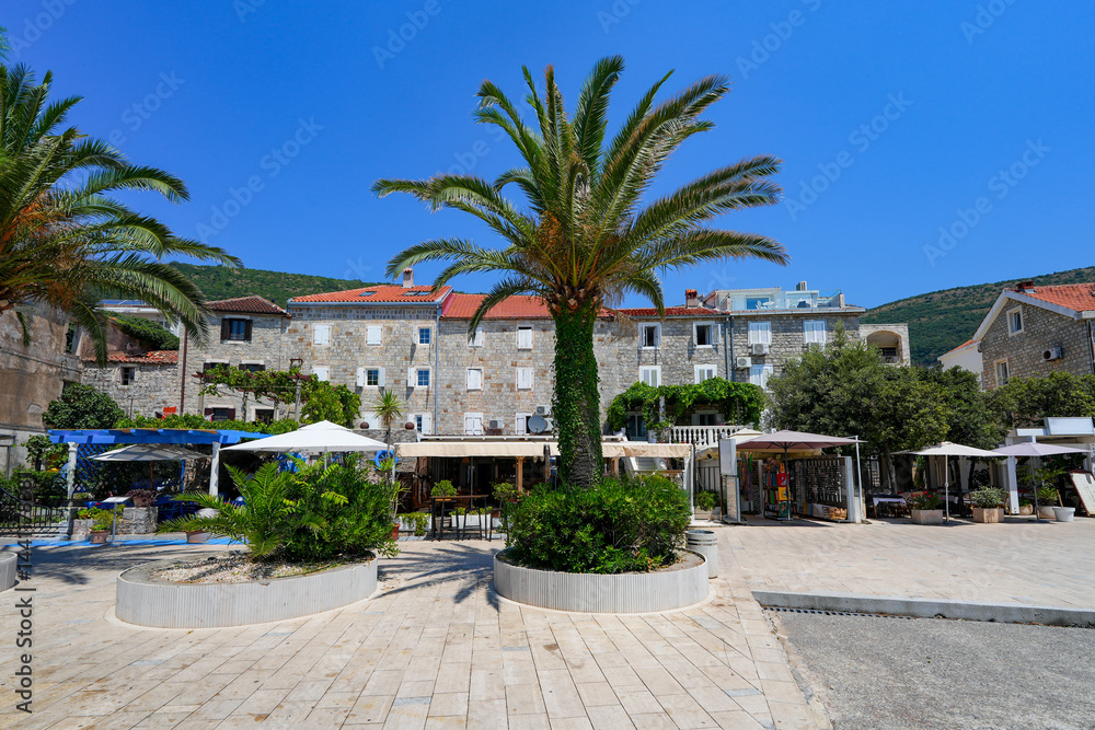 Old stone houses in Petrovac na Moru, a resort town located on the coast of the Adriatic Sea in Montenegro