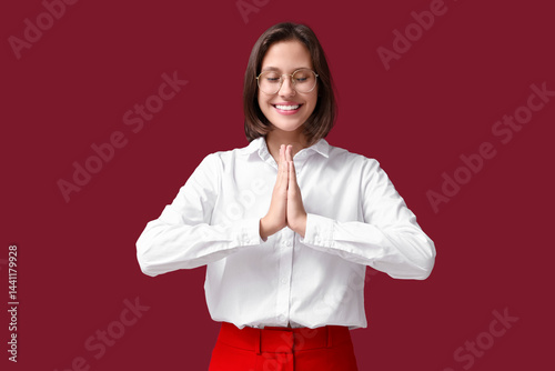 Pretty young woman meditati...