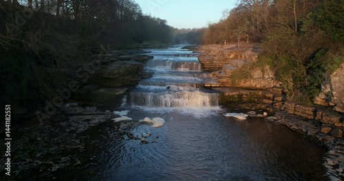 Aerial shot of waterfall in the river