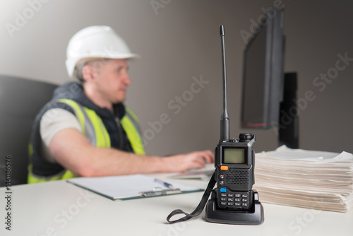 Handheld radio on a desk wi...