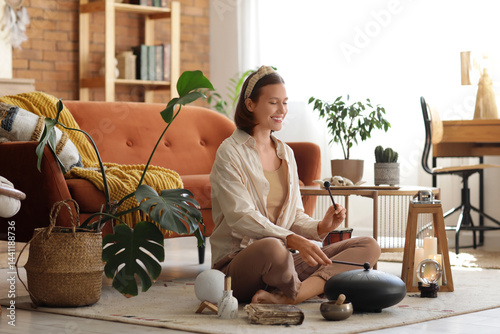 Young woman with sticks pla...