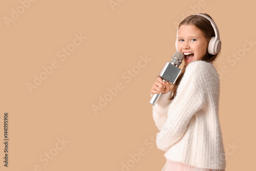 Cute girl in headphones sin...