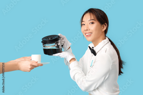 Young Asian smiling waitres...