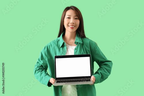 Young Asian woman with lapt...