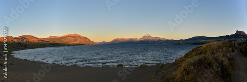 Sunrise at lago huechulafquen and peak of lanin volcano at lanin national park, patagonia, argentina