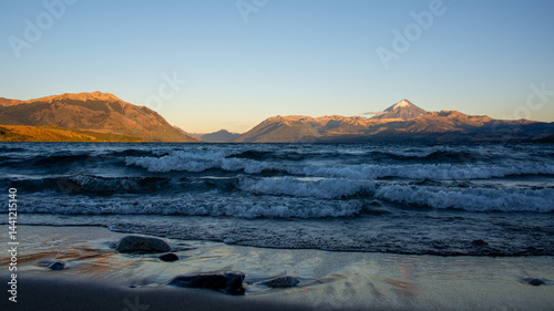Sunrise at lago huechulafquen and peak of lanin volcano at lanin national park, patagonia, argentina