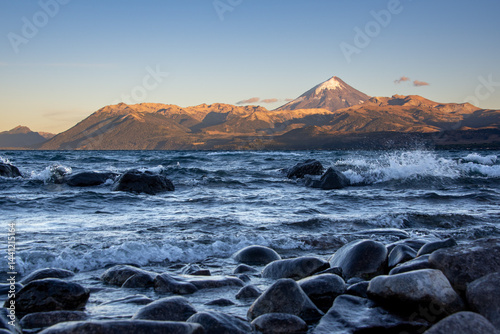 Sunrise at lago huechulafquen and peak of lanin volcano at lanin national park, patagonia, argentina