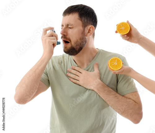 Young man using asthma inha...