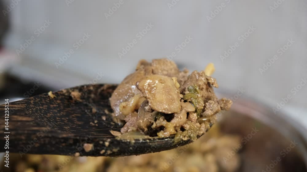 Creamy rotini Fusilli Macaroni and chicken liver with fried celery, vegetables. Preparation in stewpan, with savory sauce. Commercial kitchen Creamy rotini Fusilli Macaroni and chicken liver with fried celery, vegetables. Preparation in stewpan, with savory sauce. Commercial kitchen