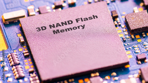 Close-up of a 3D NAND Flash Memory chip on a blue circuit board with text 