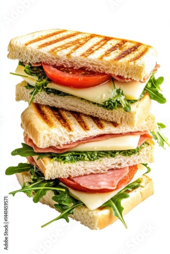 Obraz na płótnie Delicious stacked panini sandwich with ham cheese tomato and arugula on white background gourmet delight fresh ingredients culinary masterpiece food photography w salonie