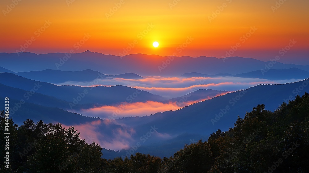 Obraz premium Sunrise Over Mountain Range with Foggy Valley Landscape