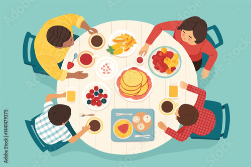 Overhead shot of a happy family enjoying a leisurely brunch, eating pancakes together.  Warm, inviting atmosphere.