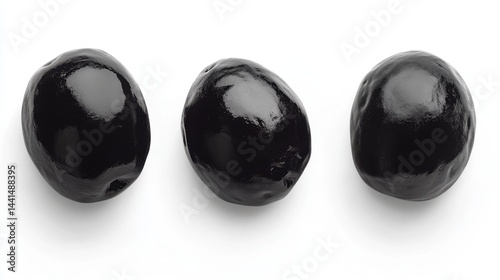 Obraz na płótnie Three glossy black olives arranged in a row on a clean white background studio shot close up of fresh olives ingredient for mediterranean cuisine w salonie