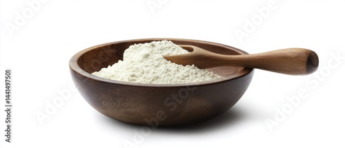Obraz na płótnie Rustic wooden bowl filled with organic flour and a small wooden spoon on a clean white background showcasing natural light for culinary projects w salonie