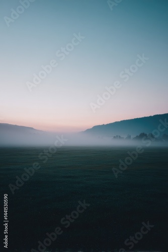 vast expanse of dense morning fog blankets serene landscape obscuring details in distance