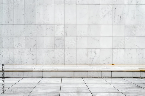 empty white marble tiled wall and floor with a single step in natural light creating a clean and minimalist architectural space