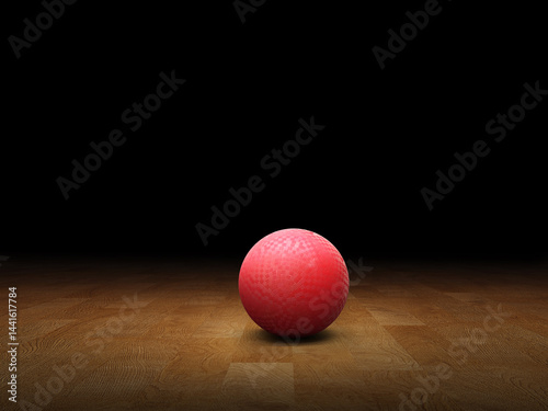 Fotografie Classic red dodgeball ball, rubber ball on wooden floor, black background