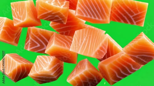 Fresh Salmon Chunks Falling from Above on Bright Green Background for Culinary Concept and Food Preparation