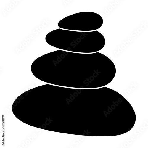 Smooth black pebbles stacked in zen stone silhouette