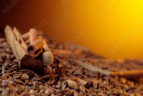 Fototapeta Naklejka Na Ścianę i Meble -  Roasted coffee beans with cinnamon sticks, anise, and nutmeg.