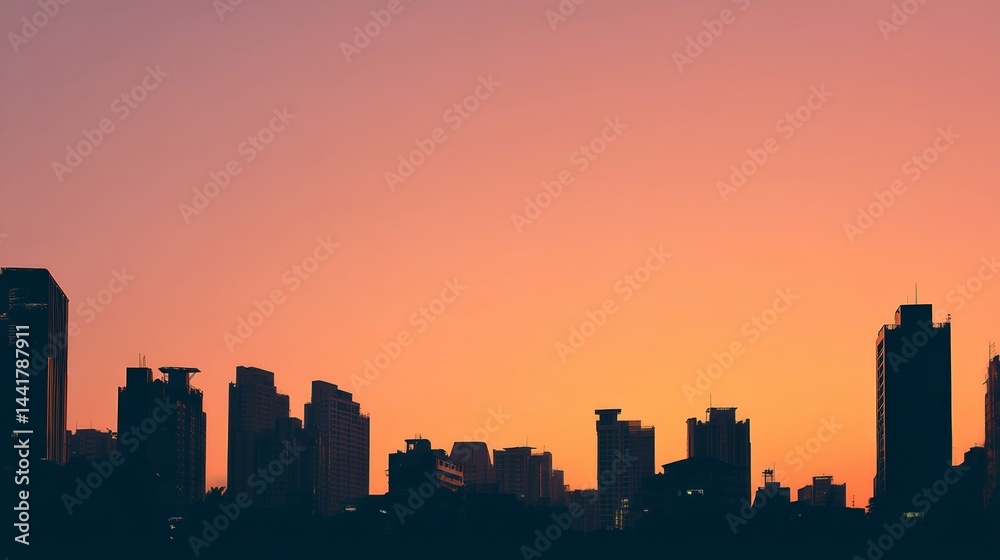 Fototapeta premium City skyline silhouette against a warm dusk sky, urban simplicity meets serene twilight.