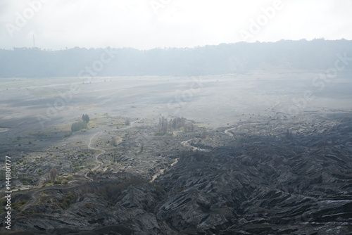 Volcanic eruption aftermath nature reserve aerial view desolate landscape foggy environment environmental impact