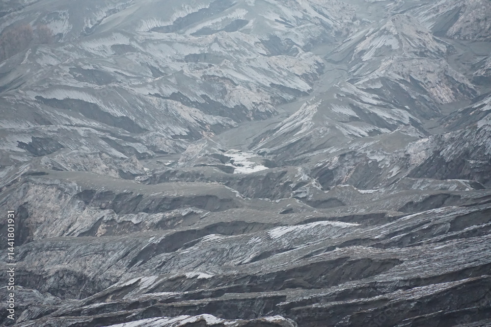 Fototapeta premium Volcanic eruption aftermath mountain range aerial view ashy landscape nature's power on display
