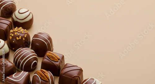 Diagonal Belgian Pralines Bottom Left Corner Cream Background