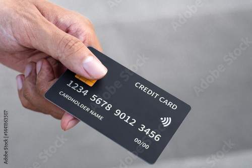 Man's hand giving credit card to person. Paying bills. finance, investment, online payment, online shopping, savings.