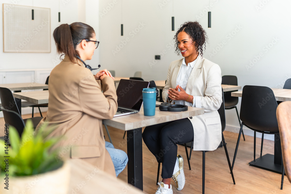 Businesswomen having a productive meeting at a modern coworking space