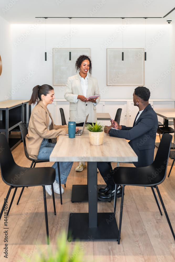 Business team collaborating on project in modern office space