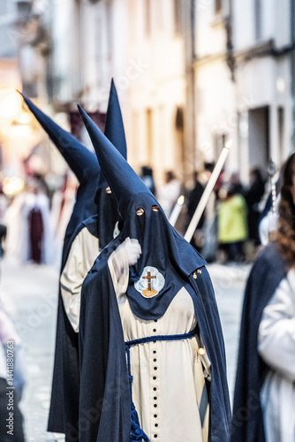 Hooded brothers with conical hats that serve as masks, Holy Week procession, Llucmajor, Mallorca, Balearic Islands, Spain