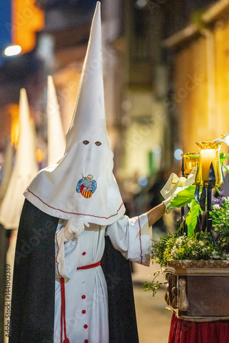 Hooded brothers with conical hats that serve as masks, Holy Week procession, Llucmajor, Mallorca, Balearic Islands, Spain
