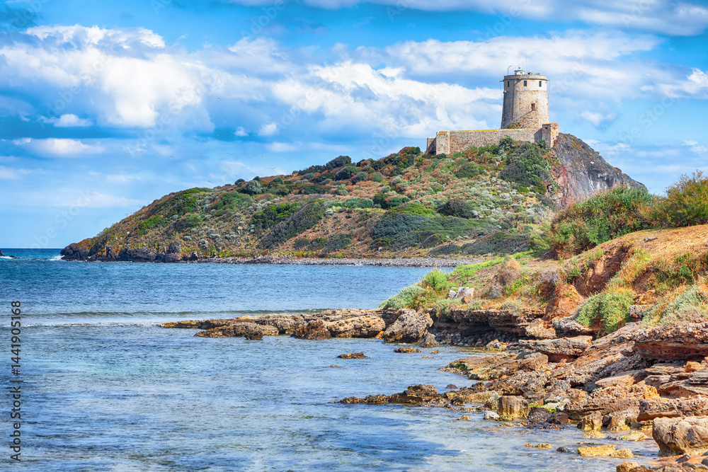 Fabulous view on Ancient Spanish tower of Coltellazzo of Saint Efisio lighthouse at Nora archeological site