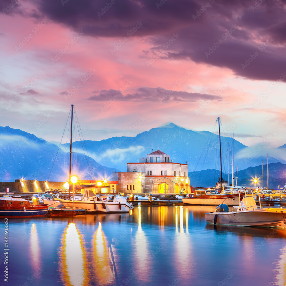 Exciting sunset view on boats in beautiful marina of Villasimius.
