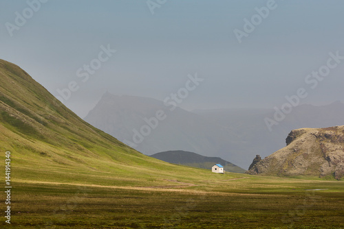 Obraz na płótnie Picturesque shelter in a green misty landscape. Icelandic loneliness scenery w salonie
