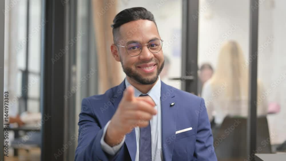 Portrait of Selecting Hispanic Businessman Pointing at Camera Portrait of Selecting Hispanic Businessman Pointing at Camera