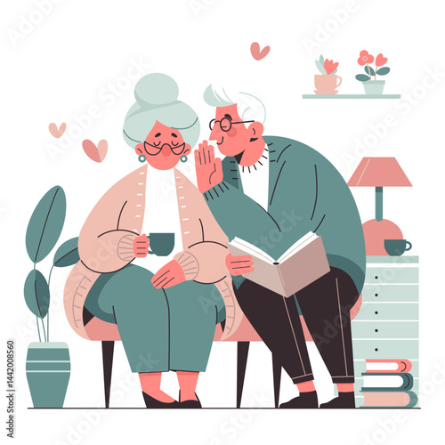 Happy elderly married couple sitting in home environment and chatting while reading a book and drinking tea.