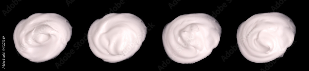 Obraz premium Set of white cosmetic cream samples isolated on black background. Cosmetic cream traces, skin care lotion.