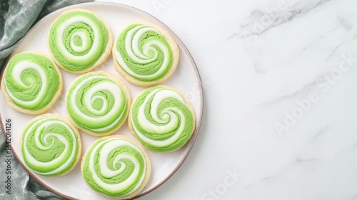 Obraz na płótnie Swirl Cookies: Delicate swirl cookies in a vibrant shade of green, resting invitingly on a pristine plate. This shot captures the delightful detail of the dessert, ready to be enjoyed. w salonie